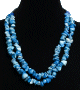 Collier ethnique artisanal imitation quartz bleu deux rangs agremente de tubes noirs