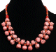 Collier ethnique artisanal imitation pierres corail agencee de perles et agrementees de pieces en metal argente