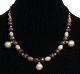 Collier ethnique artisanal imitation trois boules argentees agrementees de perles multicolores et multiformes