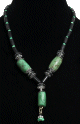 Collier ethnique artisanal imitation trois cylindres verts agrementes de perles vertes et de tubes noirs
